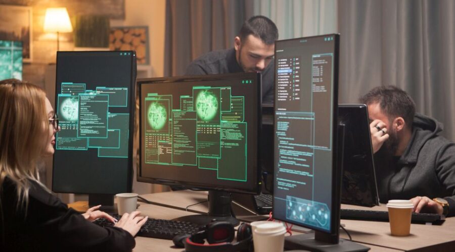 Female hacker with her team of cyber terrorists